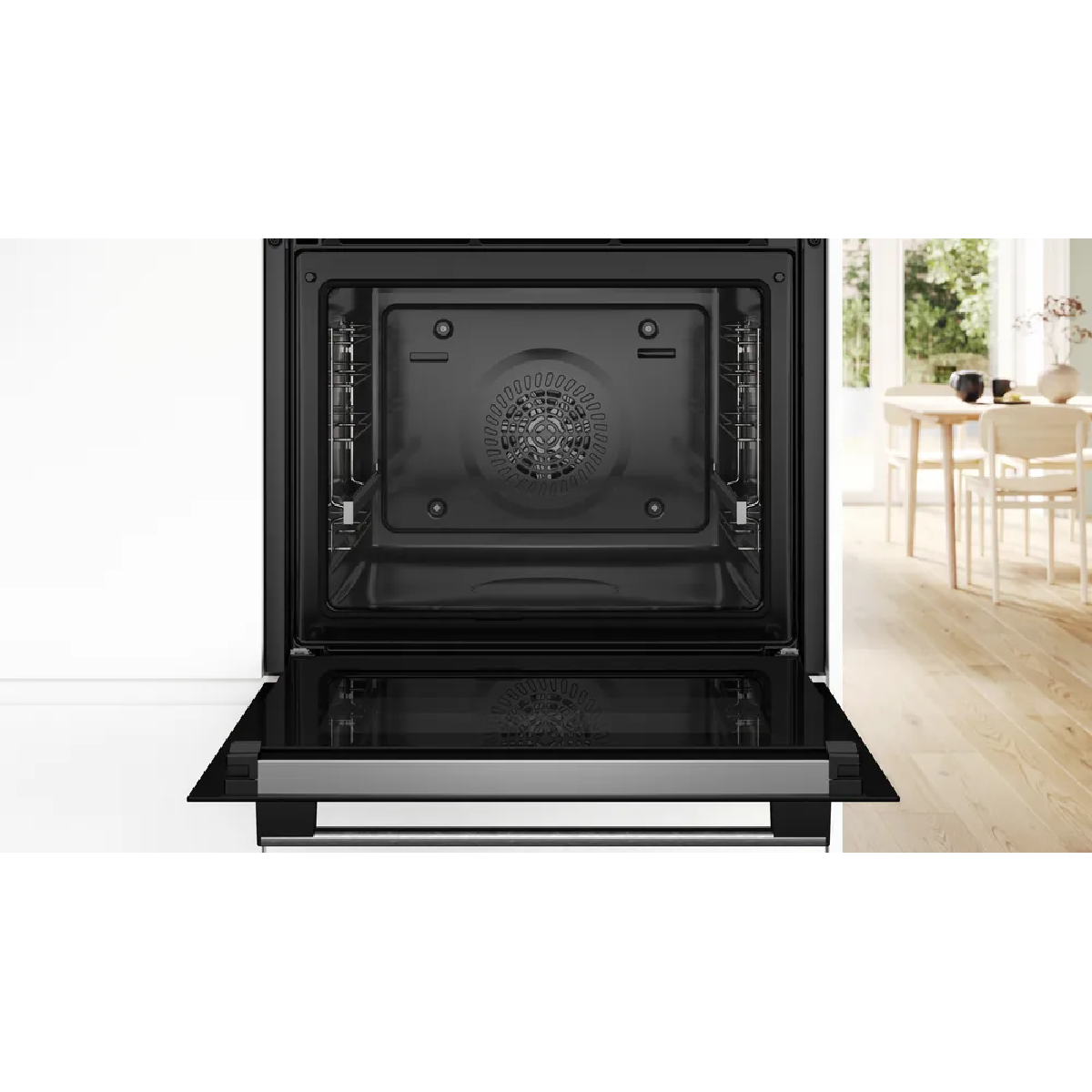 Un horno empotrado moderno con la puerta abierta, mostrando el interior.