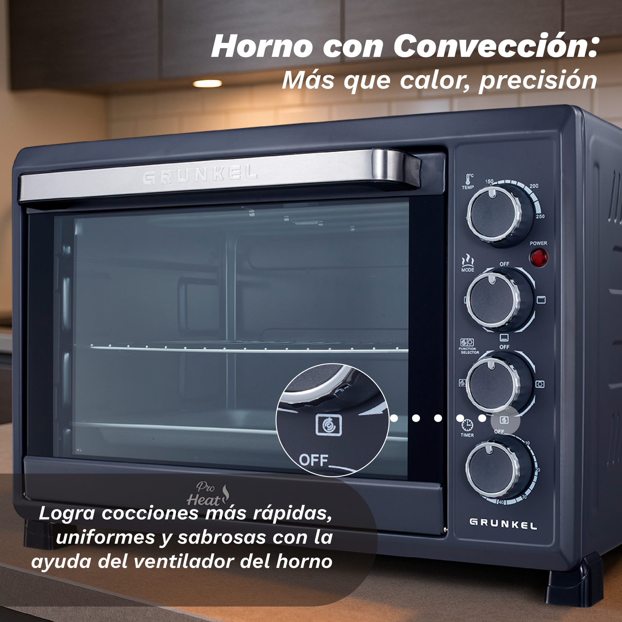 Un horno de convección oscuro con asa y mandos plateados.
