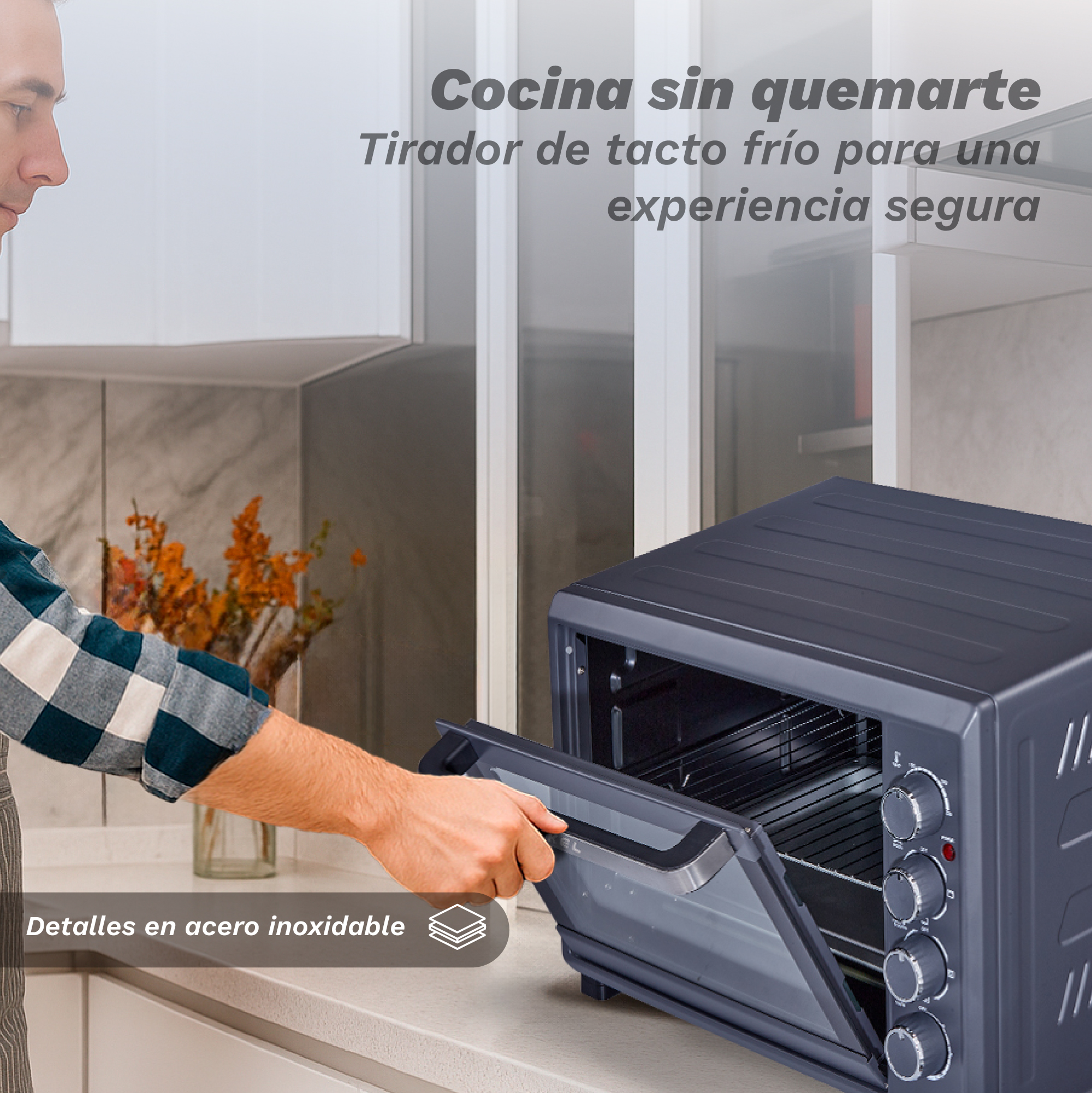 Un hombre abre un horno oscuro con detalles de acero. Un tirador de tacto frío.