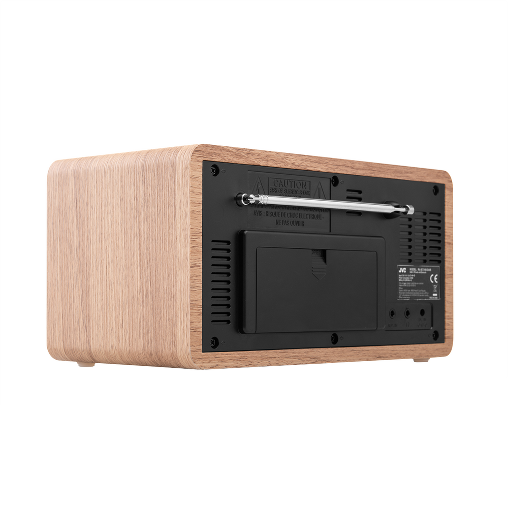 Tył drewnianego radia z wysuwaną anteną i komorą baterii.