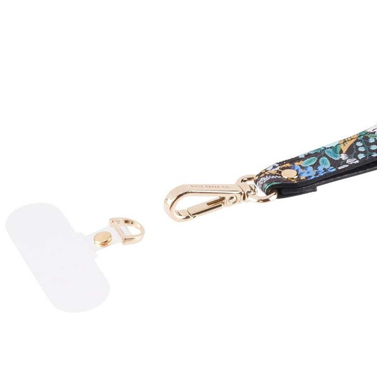 Ein weißer Handy-Gurt und ein Karabiner mit Blumenmuster.