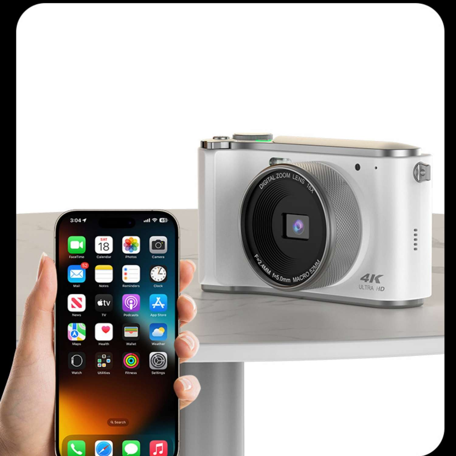 Ein iPhone mit App-Symbolen und eine weiße Digitalkamera mit 16-fach Zoom.
