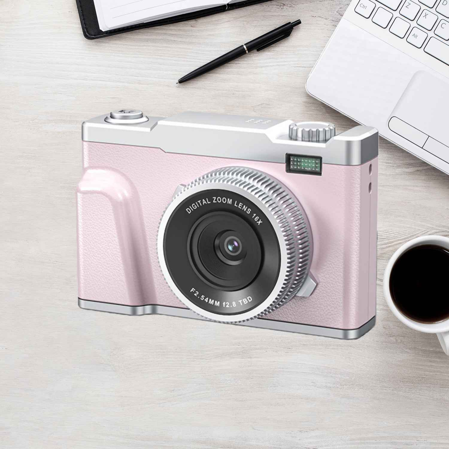 Eine rosa Digitalkamera mit silbernen Akzenten liegt auf einem Holztisch.
