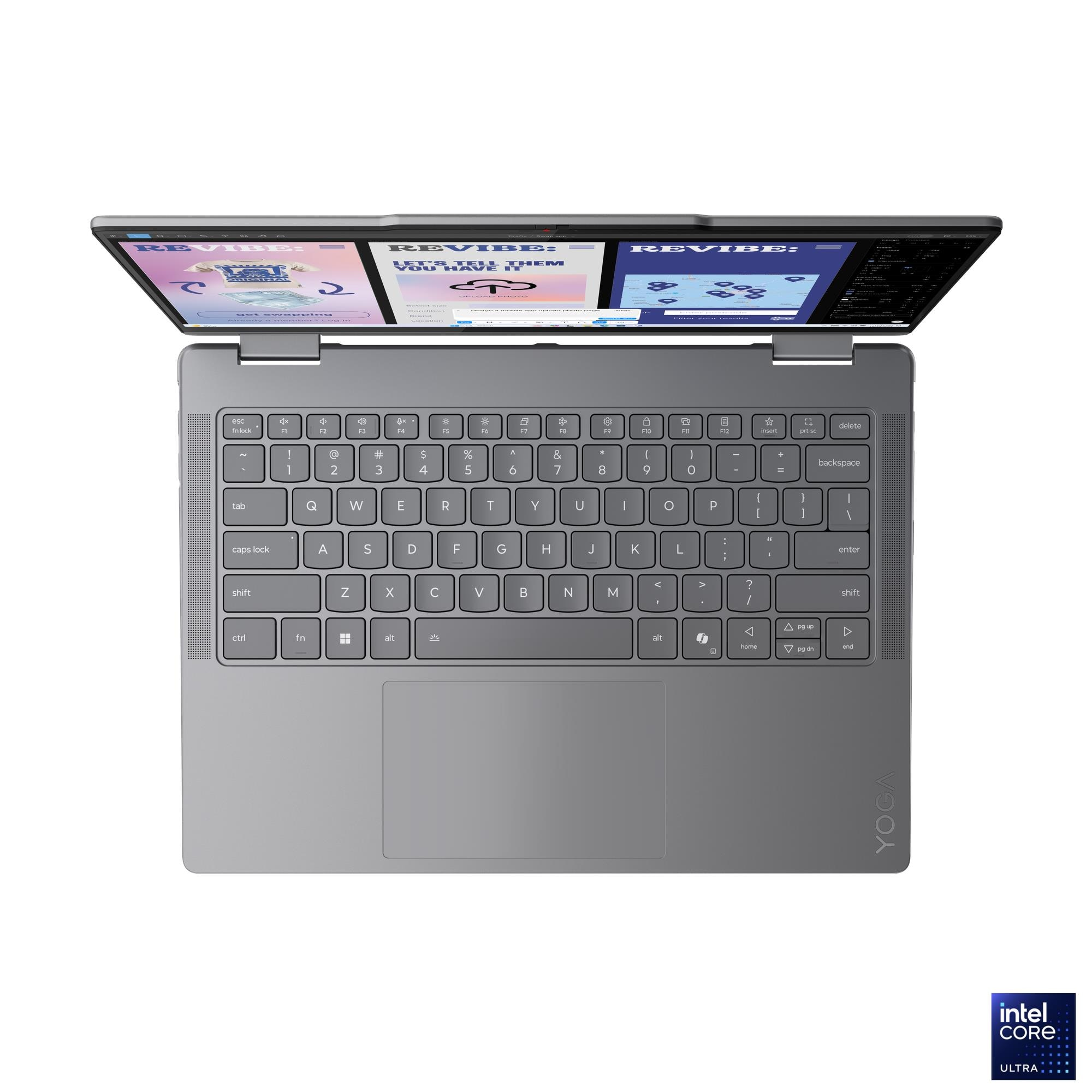 Un laptop grigio aperto con schermi illuminati che mostrano siti web.