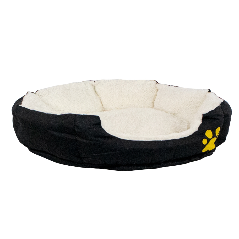 Una cama redonda y negra para mascotas con interior esponjoso color crema y huella amarilla.