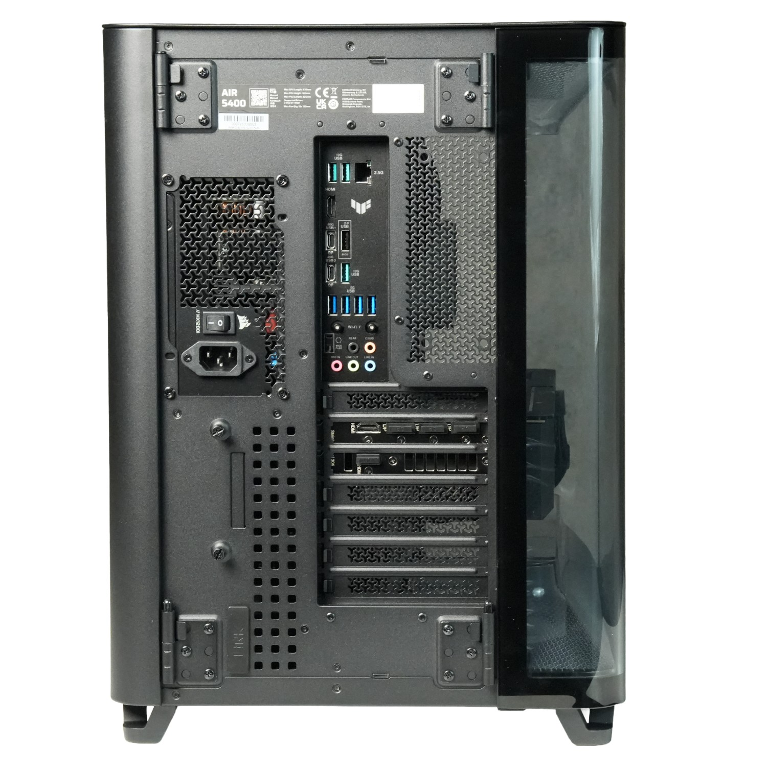 Vista trasera de una caja de PC negra mostrando ventilaciones y puertos.