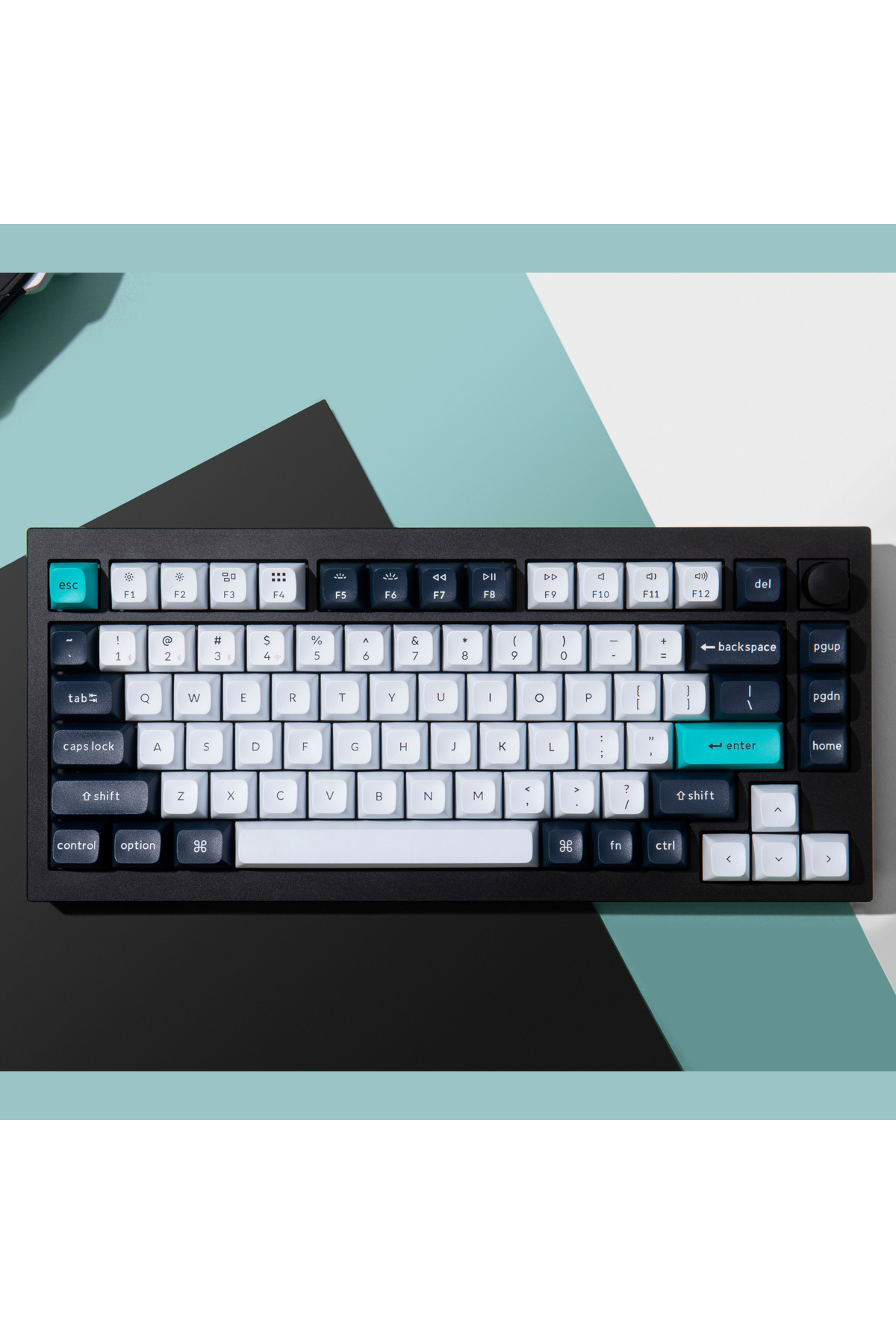 Un teclado negro con teclas blancas y azules sobre un fondo pastel.