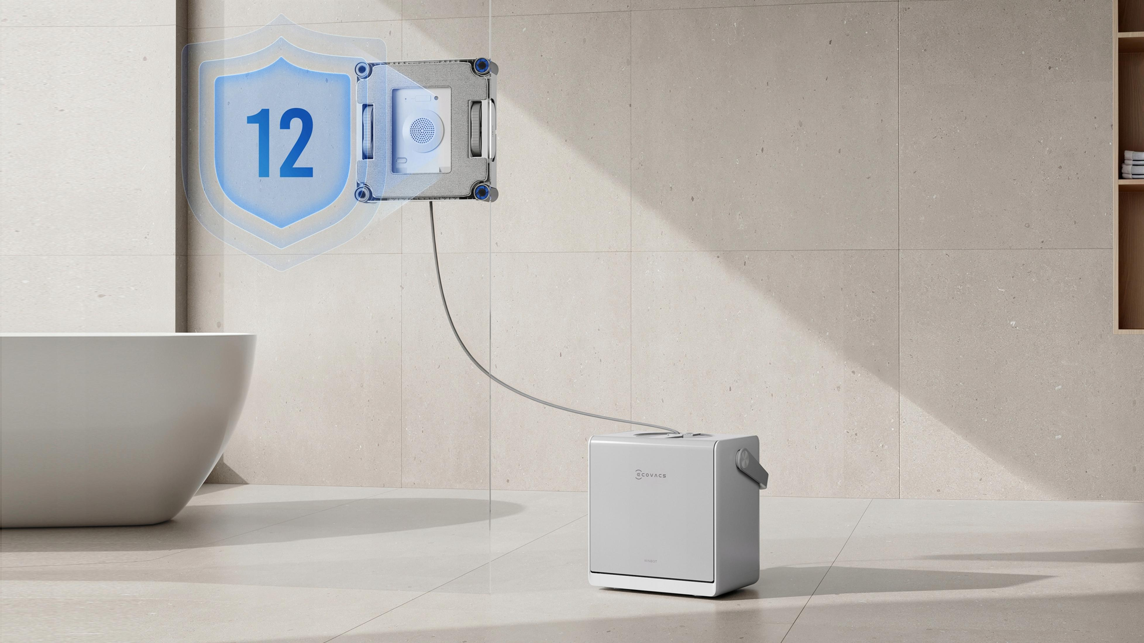 Robot do czyszczenia okien czyści wyłożoną kafelkami ścianę obok wanny.