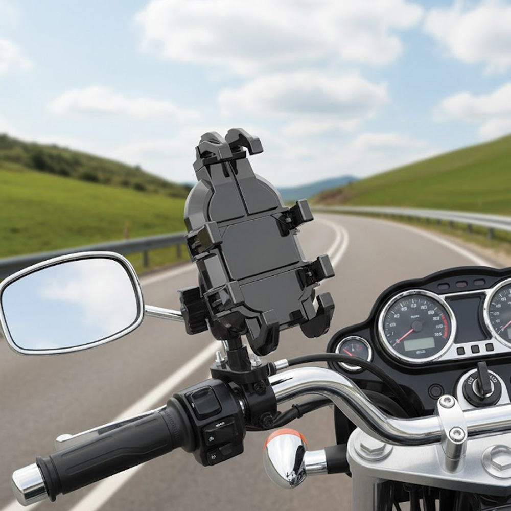 Yeşil tepeli virajlı yolda motosiklet telefon tutucu.