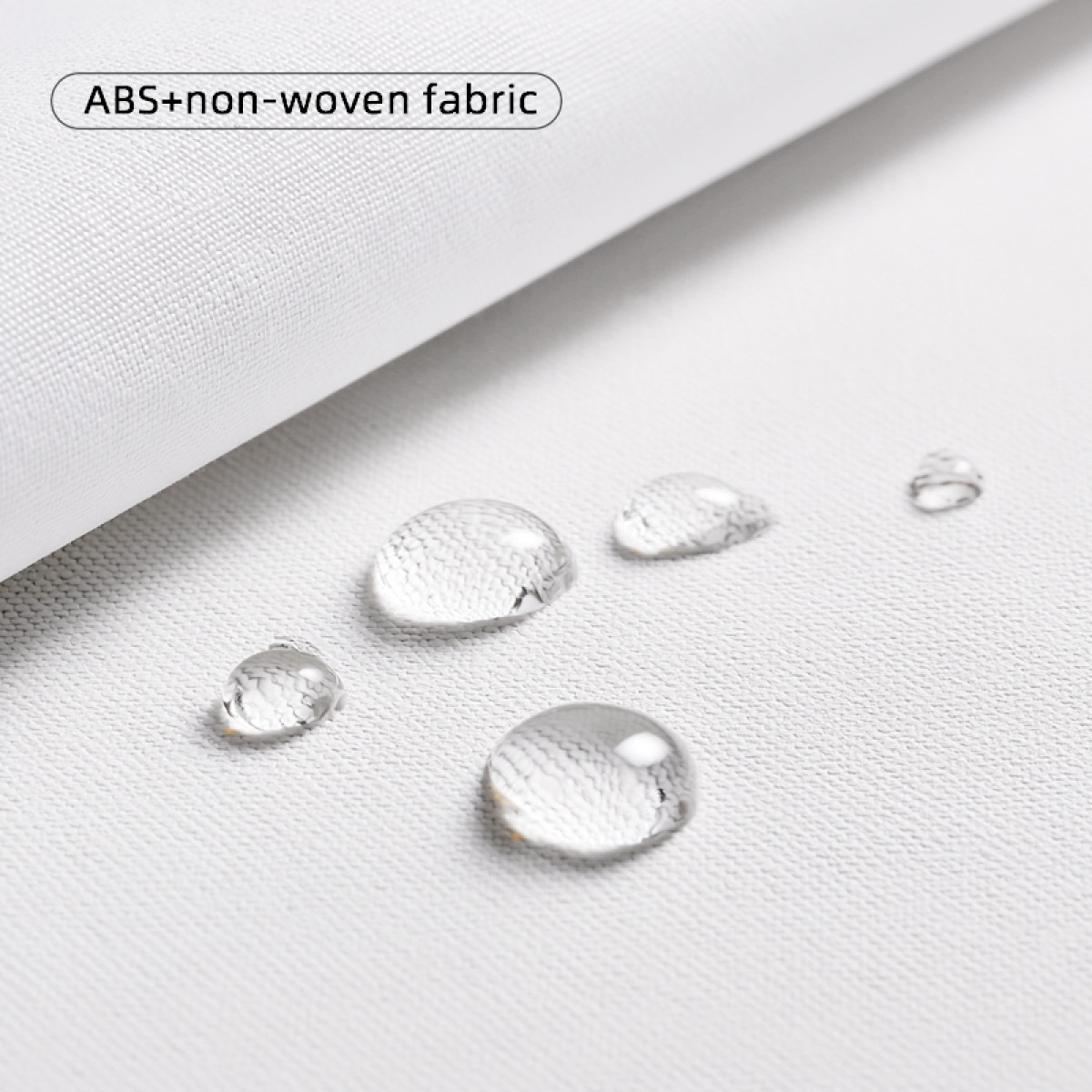 Krople wody na białej tkaninie ABS+włókninowej.