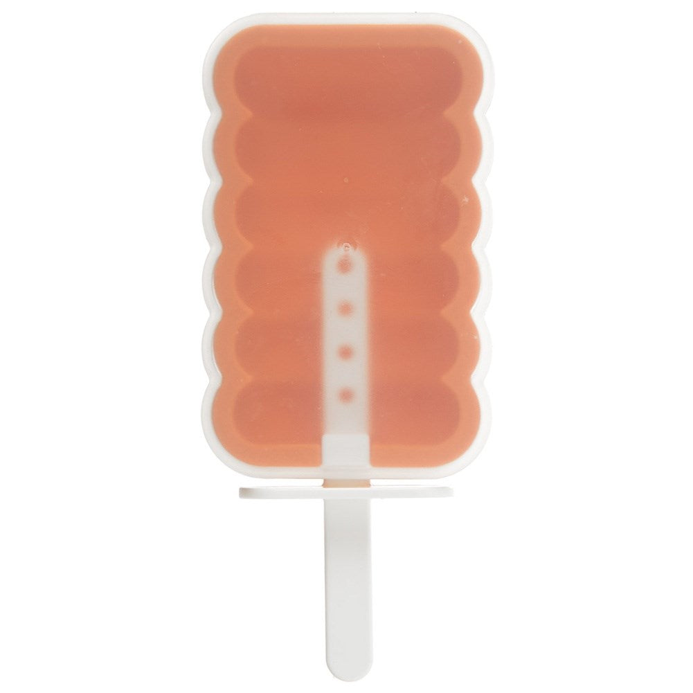 Un molde de paleta naranja con crestas y un mango blanco.