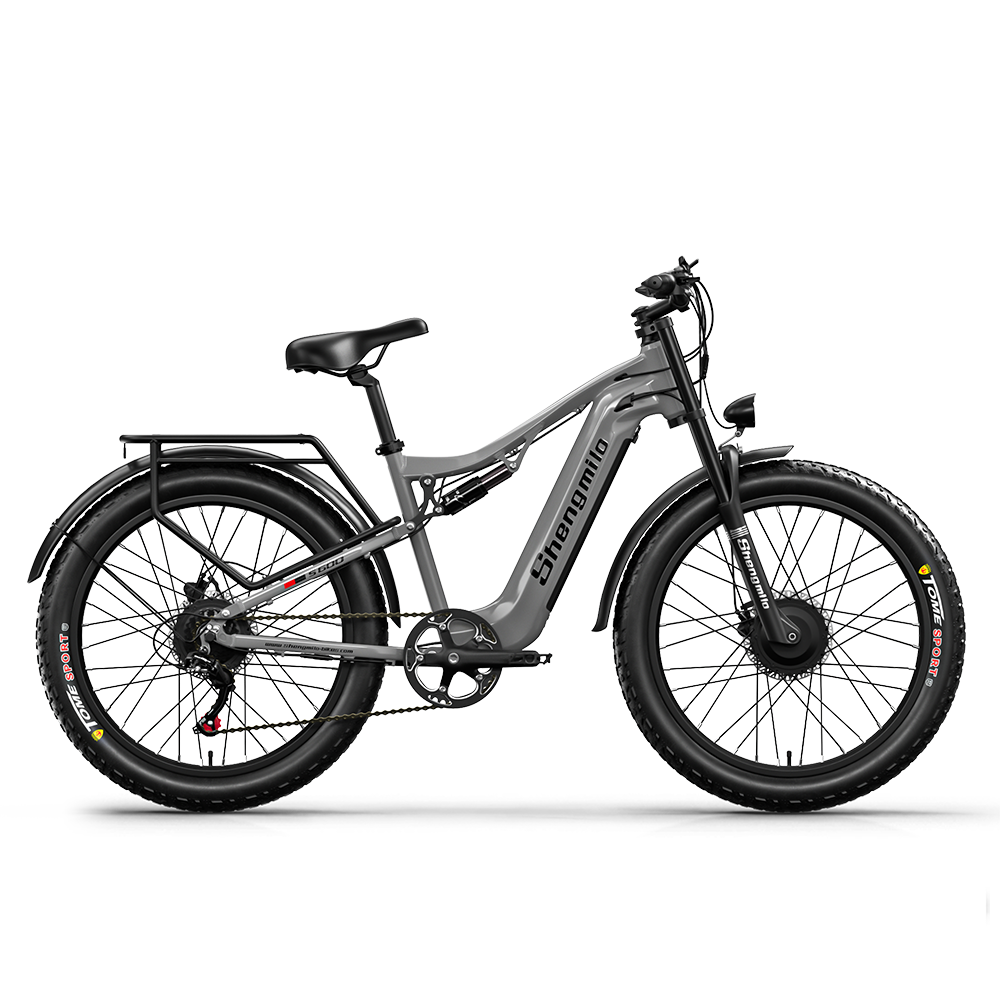 Graues E-Bike mit breiten Reifen, Federung und Gepäckträger.