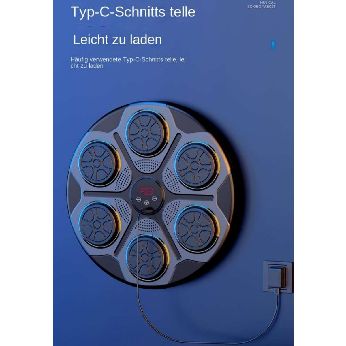 Ein rundes, graues Gerät mit sechs Ladebuchsen, das an einer blauen Wand hängt.