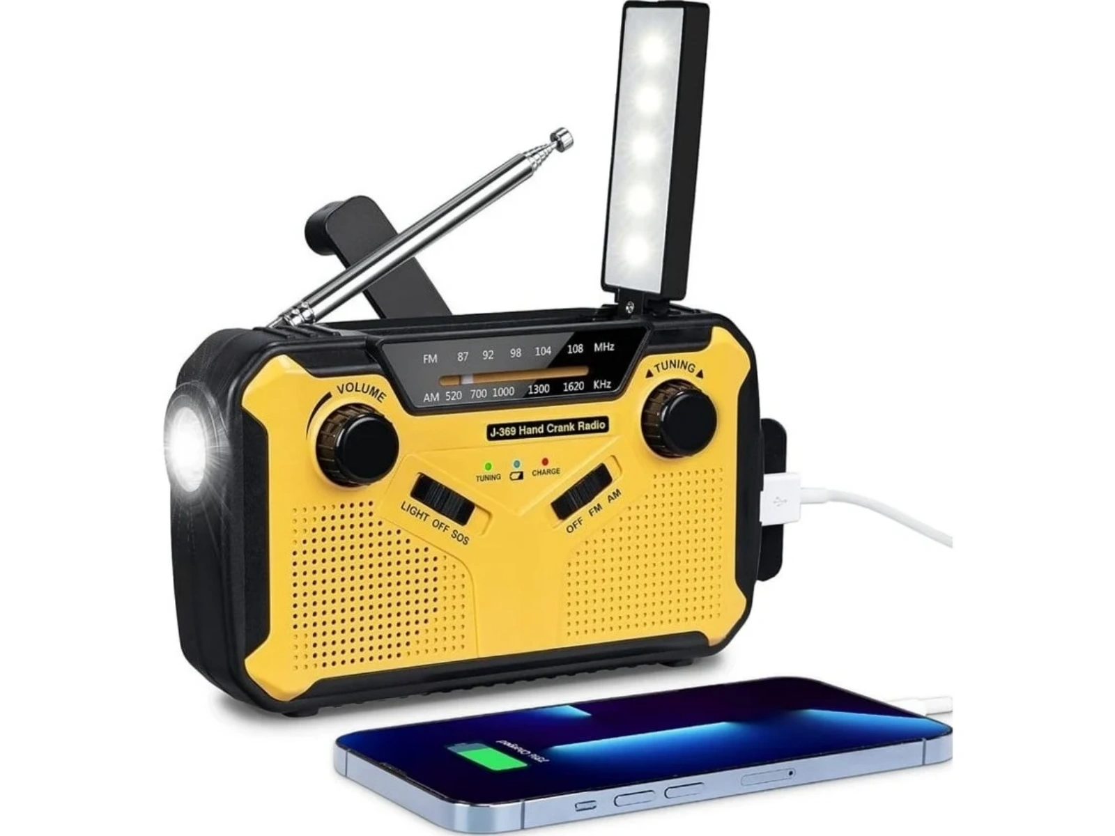 Ein gelbes Kurbelradio mit LED-Lampe und Antenne, lädt ein Smartphone.