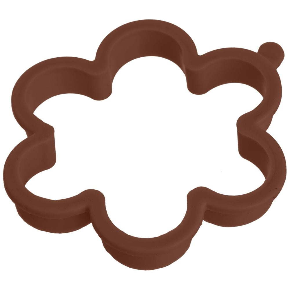Un cortador de galletas de plástico marrón en forma de flor.