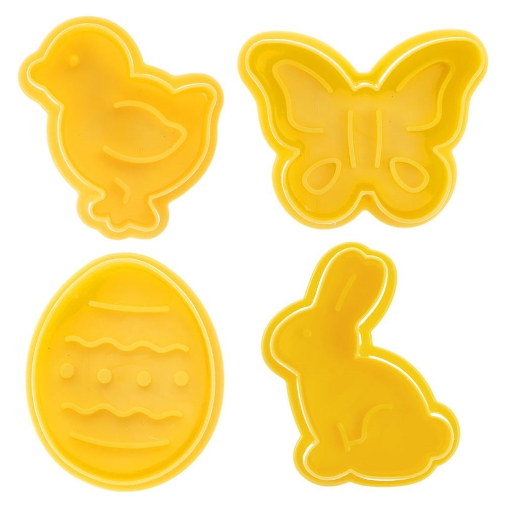 Cuatro cortadores de galletas de Pascua amarillos: pollito, mariposa, huevo y conejo.
