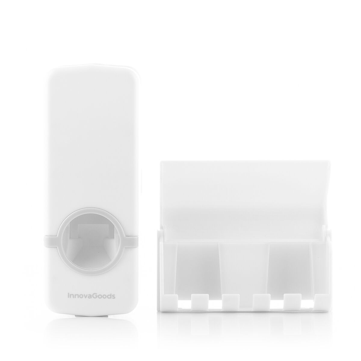 Ein weißer Zahncreme-Dispenser und ein weißer Halter für Zahnbürsten.