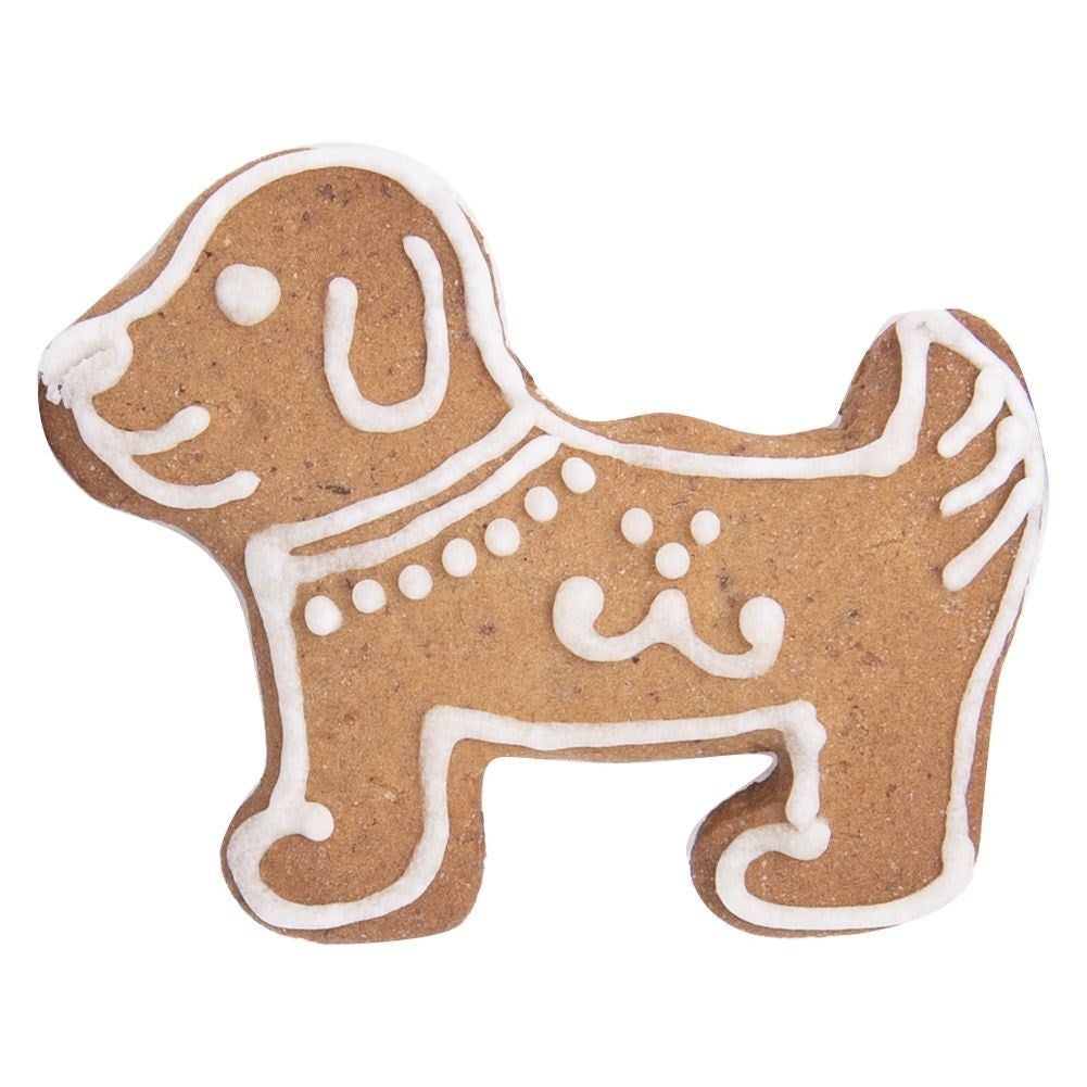 Una galleta de jengibre marrón con forma de perro, decorada con glaseado blanco.