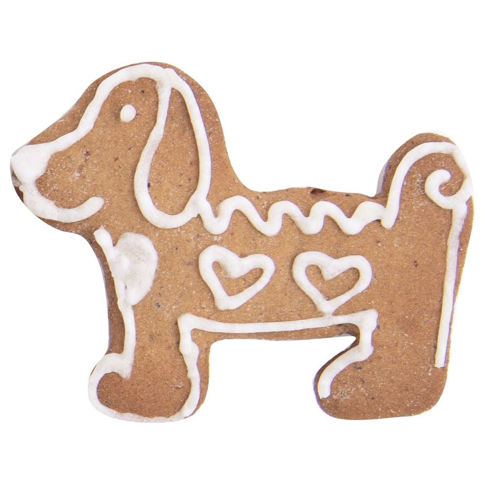 Una galleta de jengibre con forma de perro decorada con glaseado blanco.