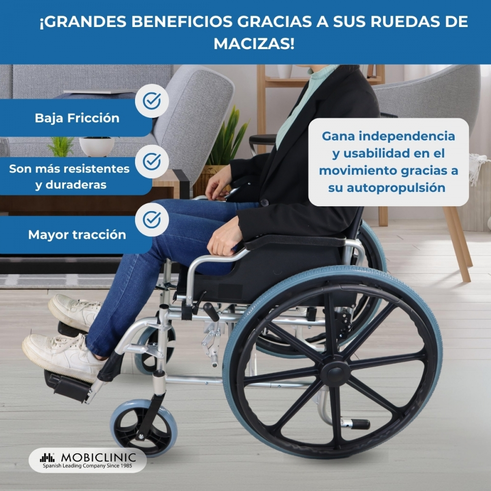 Persona en silla de ruedas, destacando beneficios como baja fricción, durabilidad y tracción.