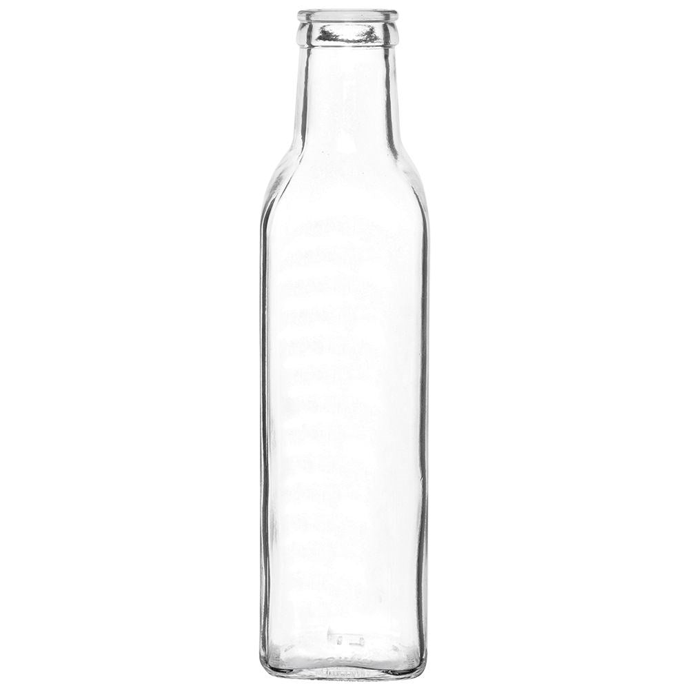 Una botella de vidrio vacía y transparente sobre fondo blanco.