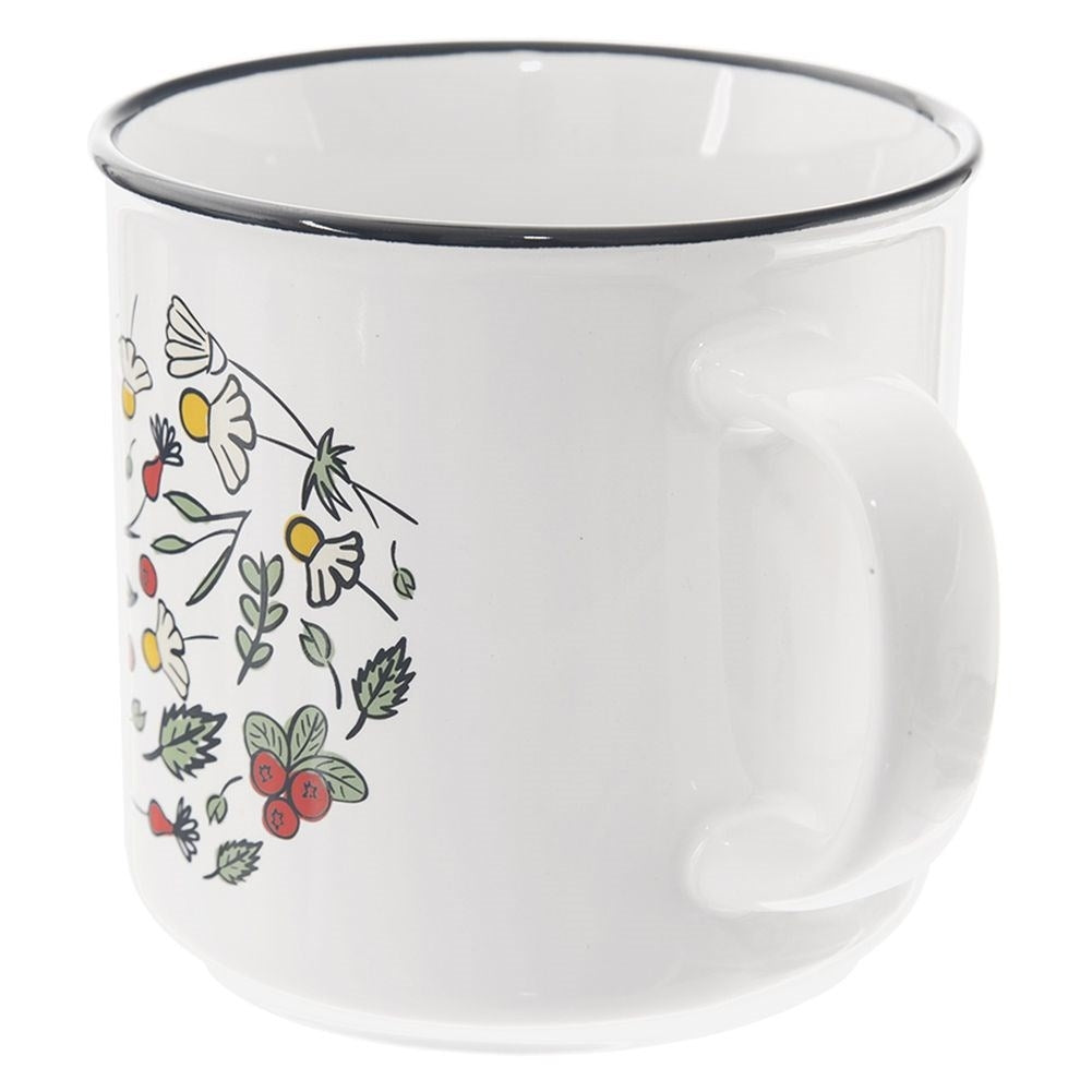 Taza blanca con borde negro, decorada con flores y bayas coloridas.