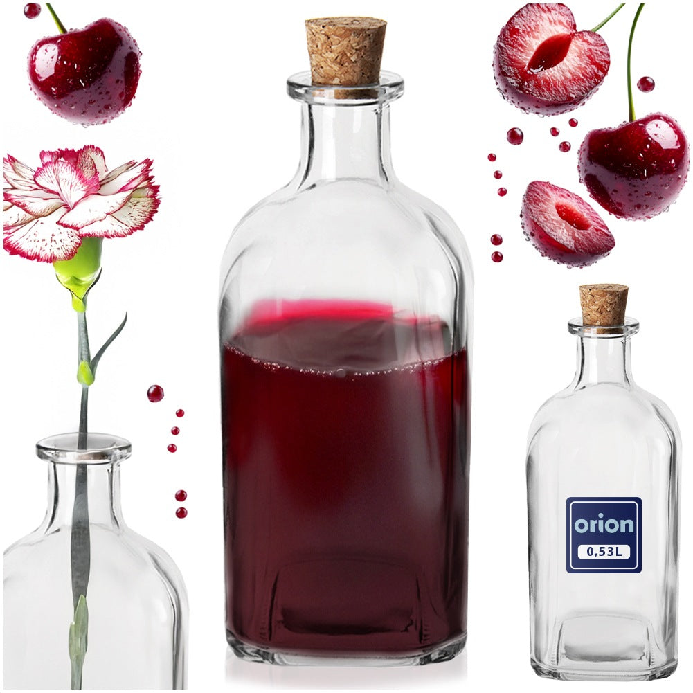 Tres botellas de vidrio, cerezas y una flor sobre fondo blanco.
