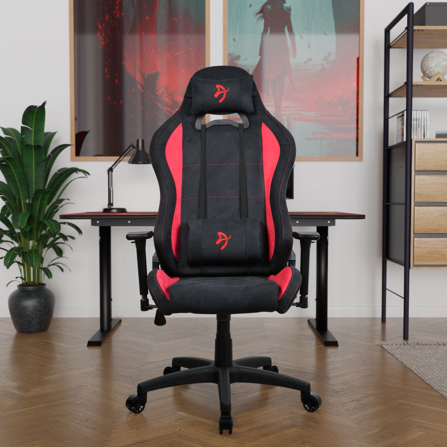 Zwarte gamestoel met rode accenten voor een bureau.
