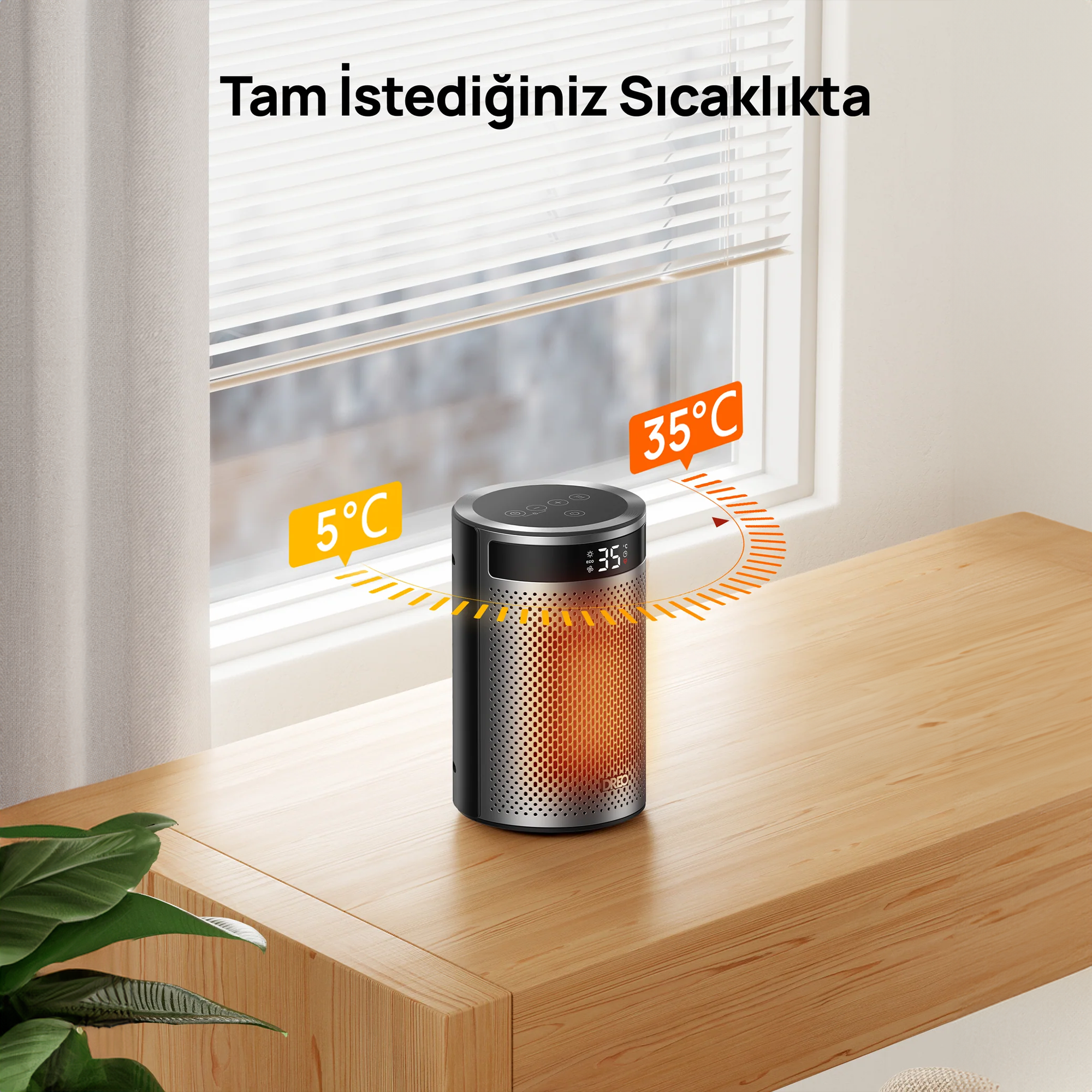 Ahşap masa üzerinde siyah kule tipi ısıtıcı, sıcaklık göstergeleriyle.