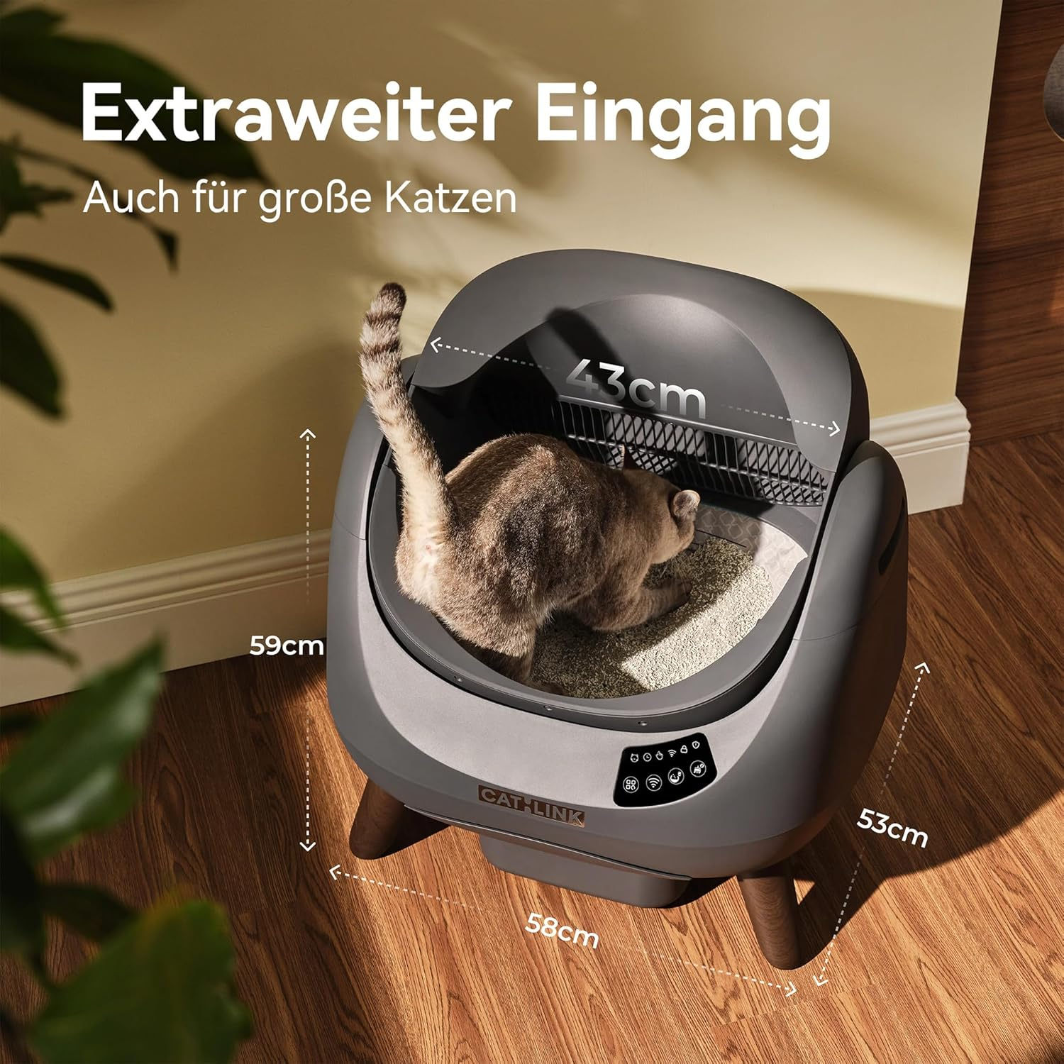 Eine Katze benutzt eine graue automatische Katzentoilette mit Maßen.