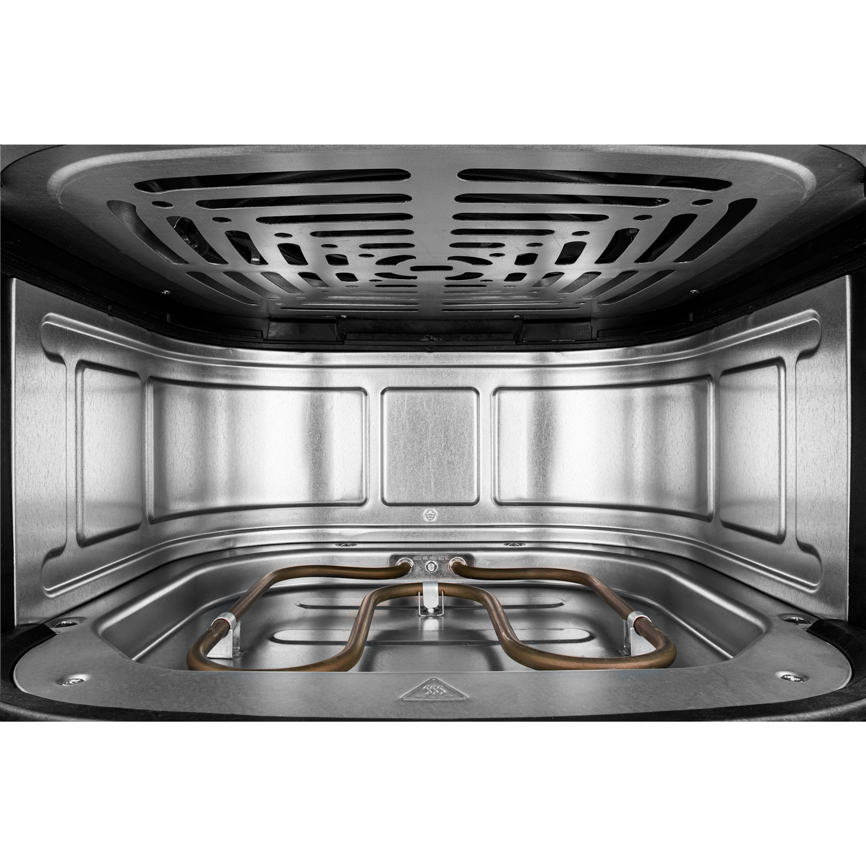 Wnętrze piekarnika z elementami grzewczymi i kratką wentylacyjną.