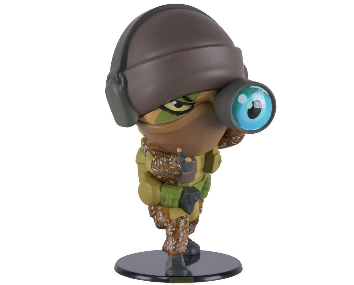 Eine Cartoon-Figur in Tarnung mit braunem Helm und einem großen blauen Auge.