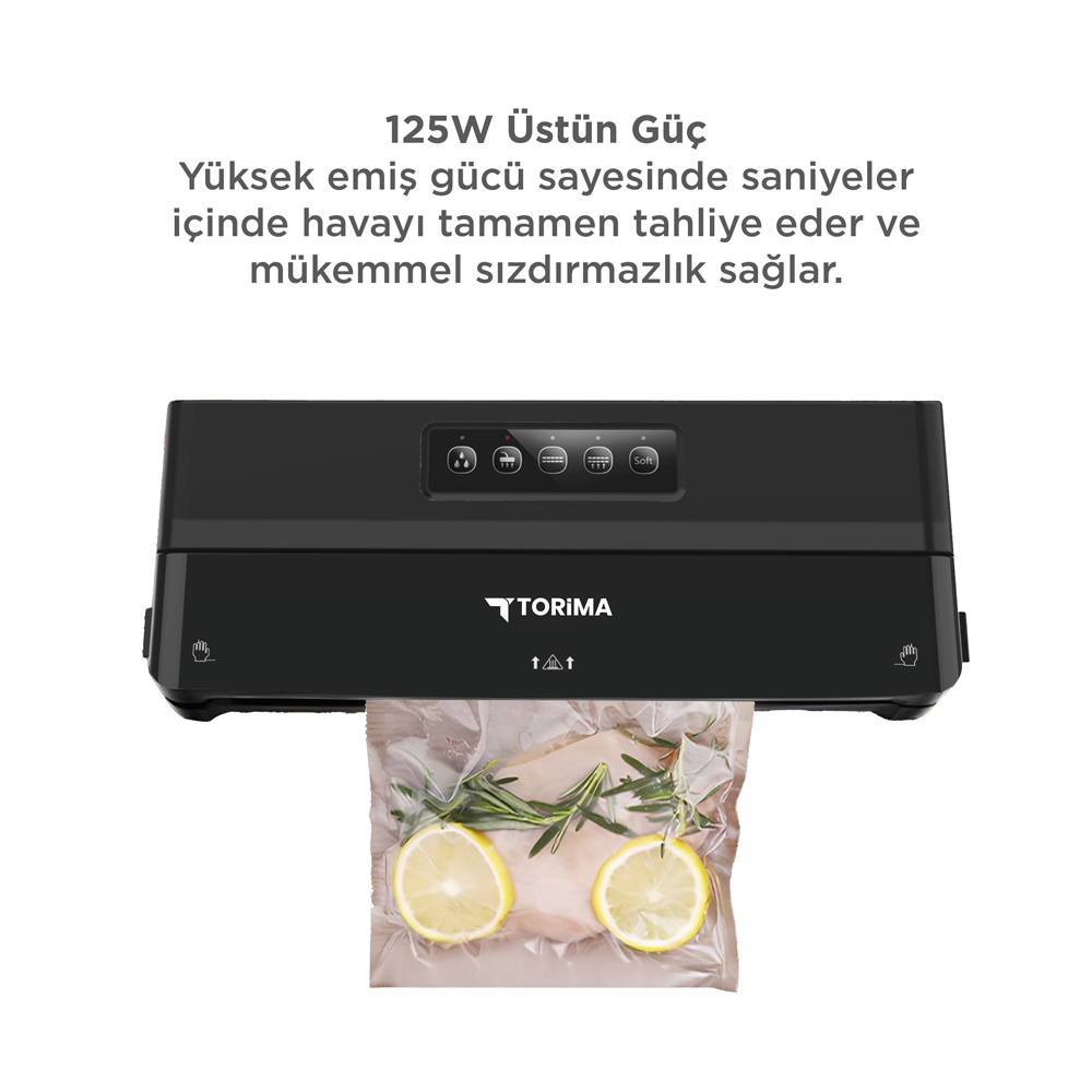 Siyah vakum makinesi, limon dilimleri ve biberiye dallarıyla yiyecek paketliyor.