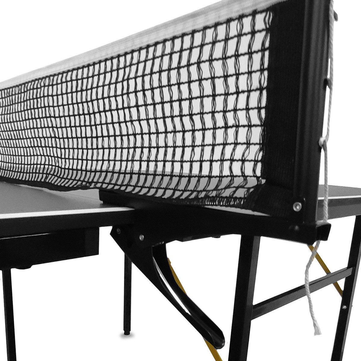 Close-up of a ping pong net on a black table with white legs against a white background.