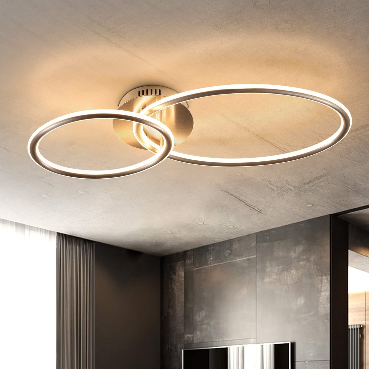 Lampada da soffitto moderna con due anelli sovrapposti e illuminazione LED.