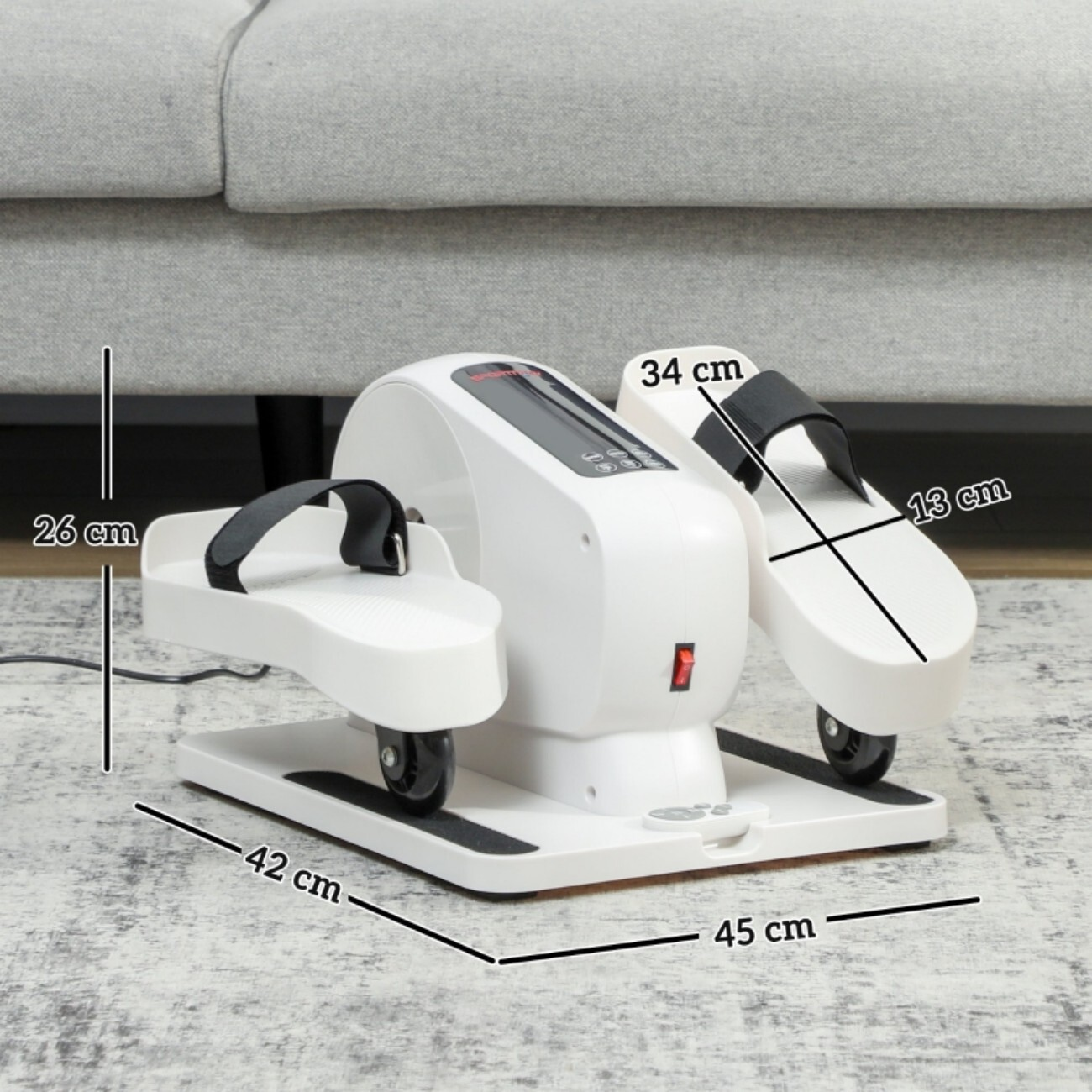 Biała maszyna do ćwiczeń z pedałami i wymiarami.