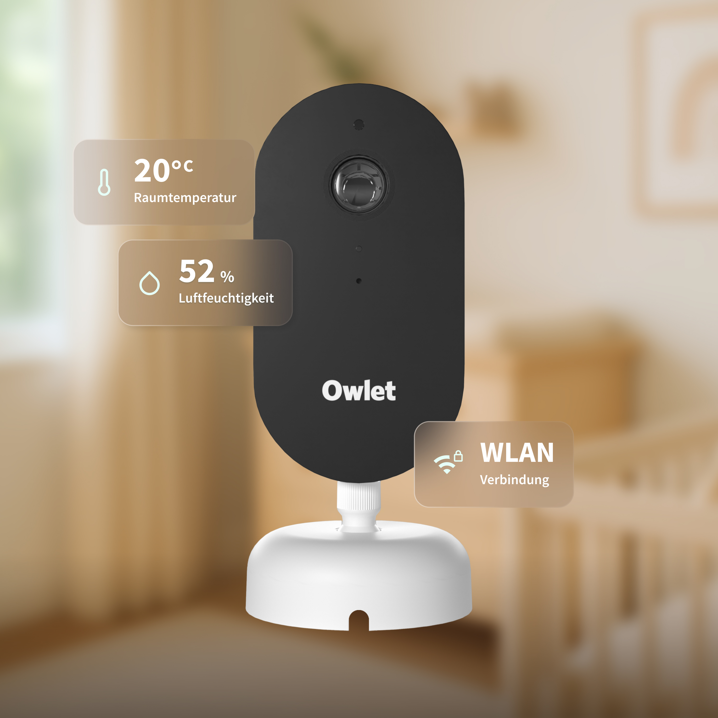 Ein schwarzer Owlet Baby Monitor auf weißem Sockel zeigt 20°C, 52% Luftfeuchte und WLAN-Verbindung.