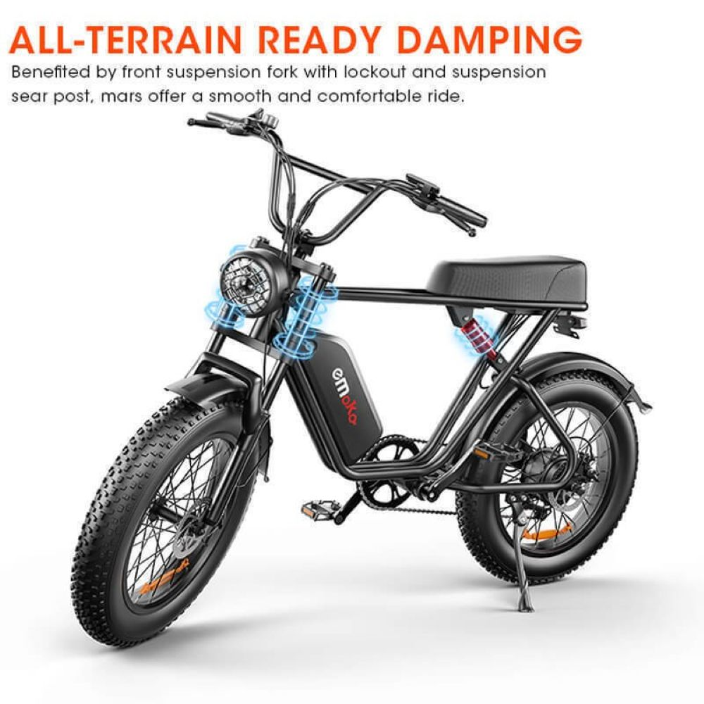 E-bike nera con pneumatici larghi, sospensioni anteriori e posteriori.