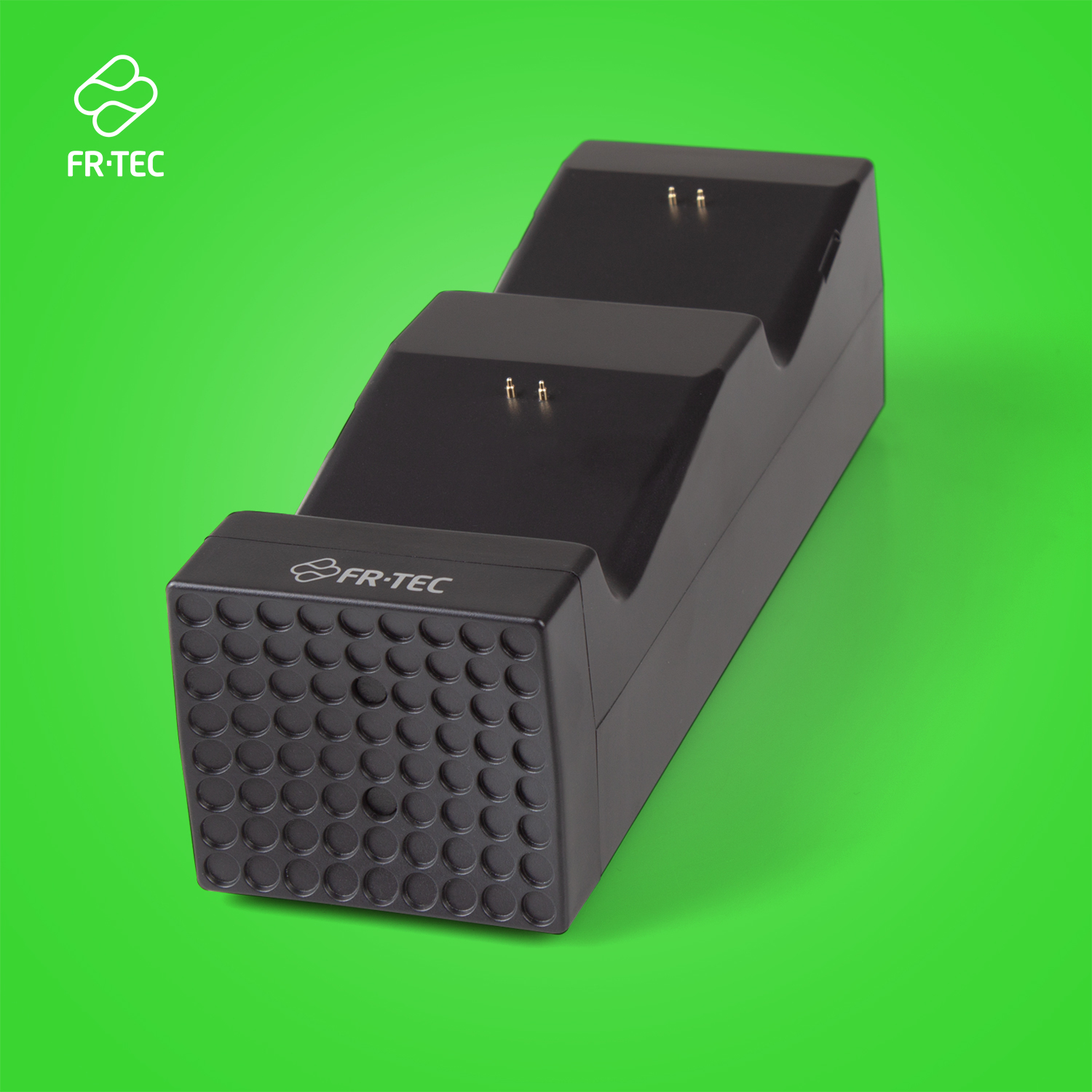 Schwarzes Ladegehäuse für zwei Controller mit FR-TEC Logo auf grünem Hintergrund.