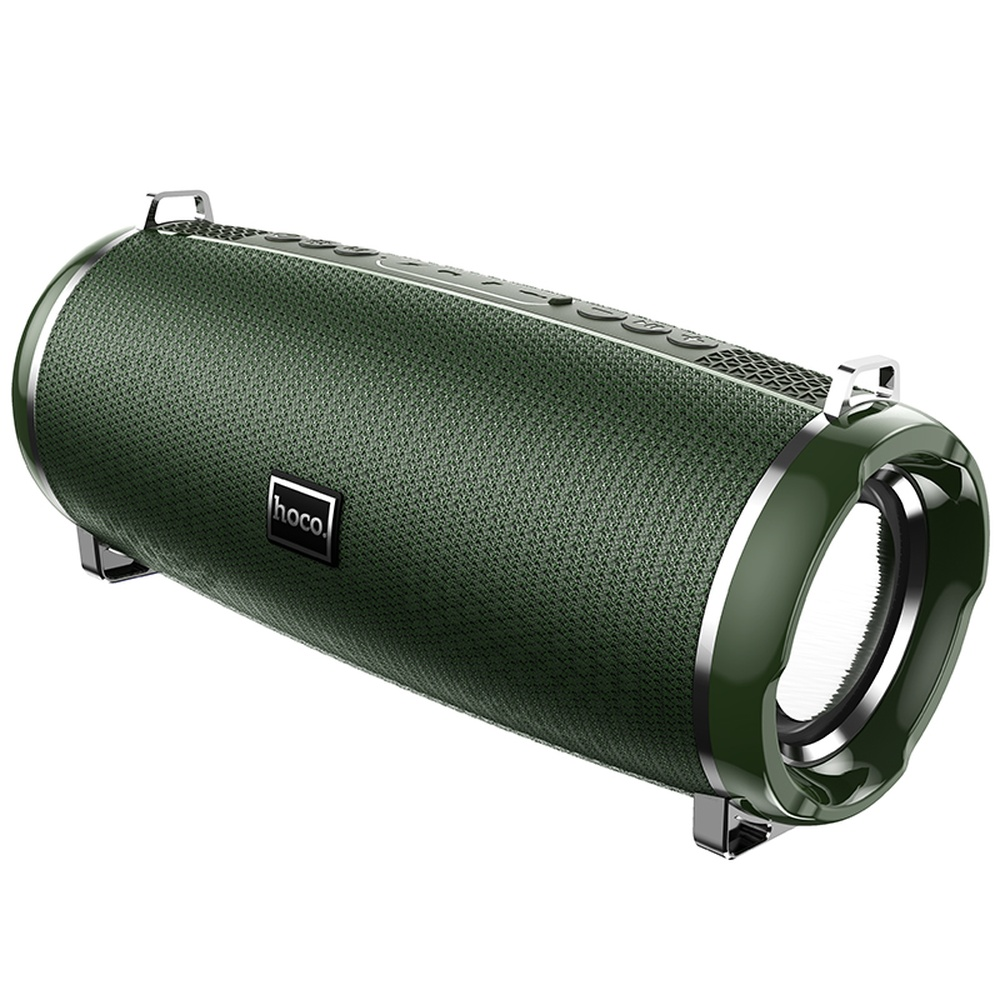 Altavoz cilíndrico verde con detalles plateados y botones de control.