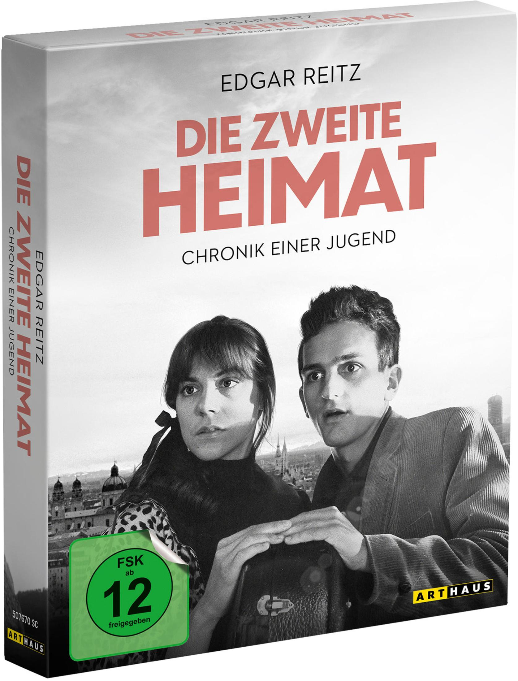 Copertina DVD: Uomo e donna sembrano preoccupati. "Die Zweite Heimat".