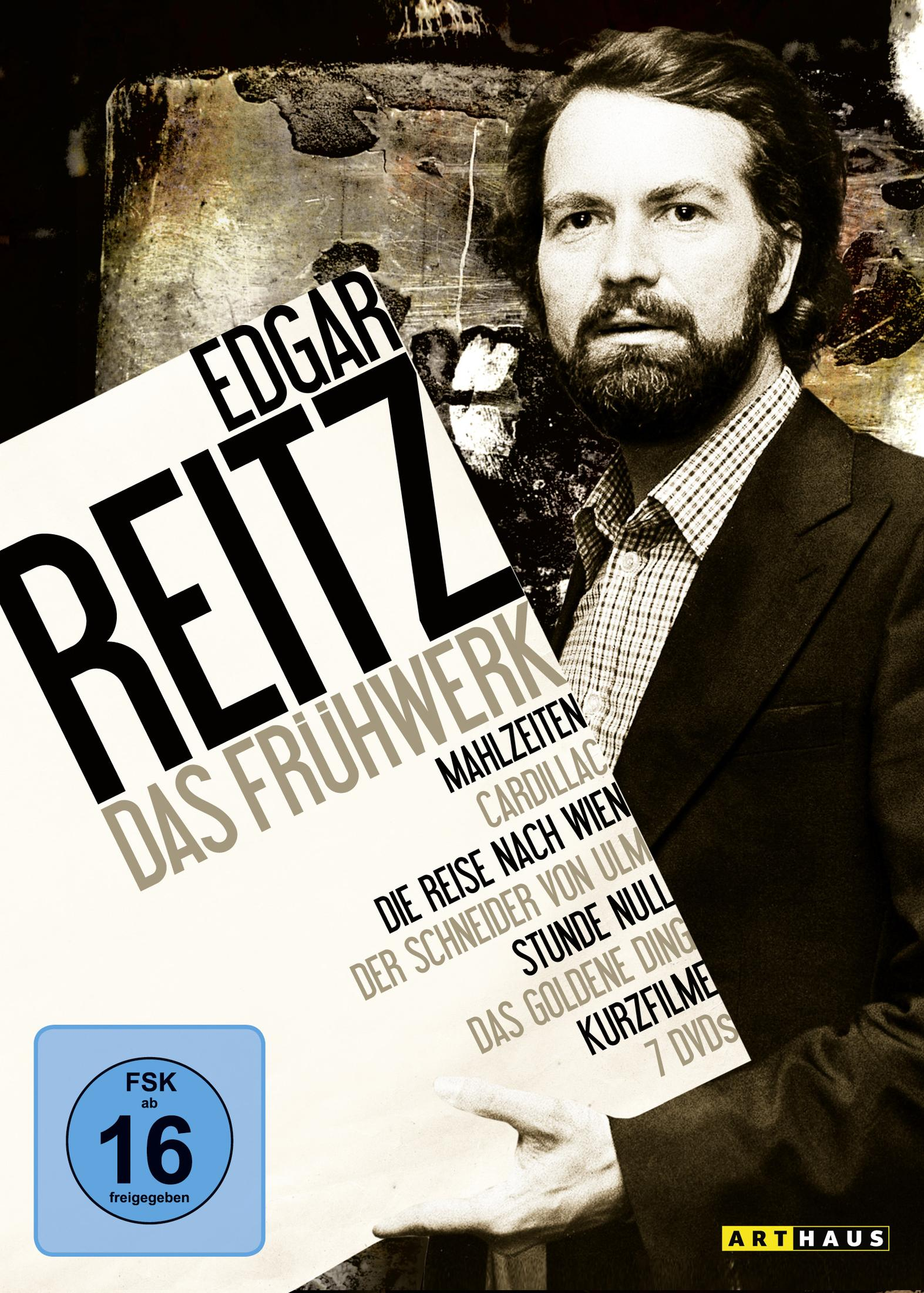 Edgar Reitz hält eine DVD-Box mit dem Titel "Das Frühwerk". FSK 16-Siegel.