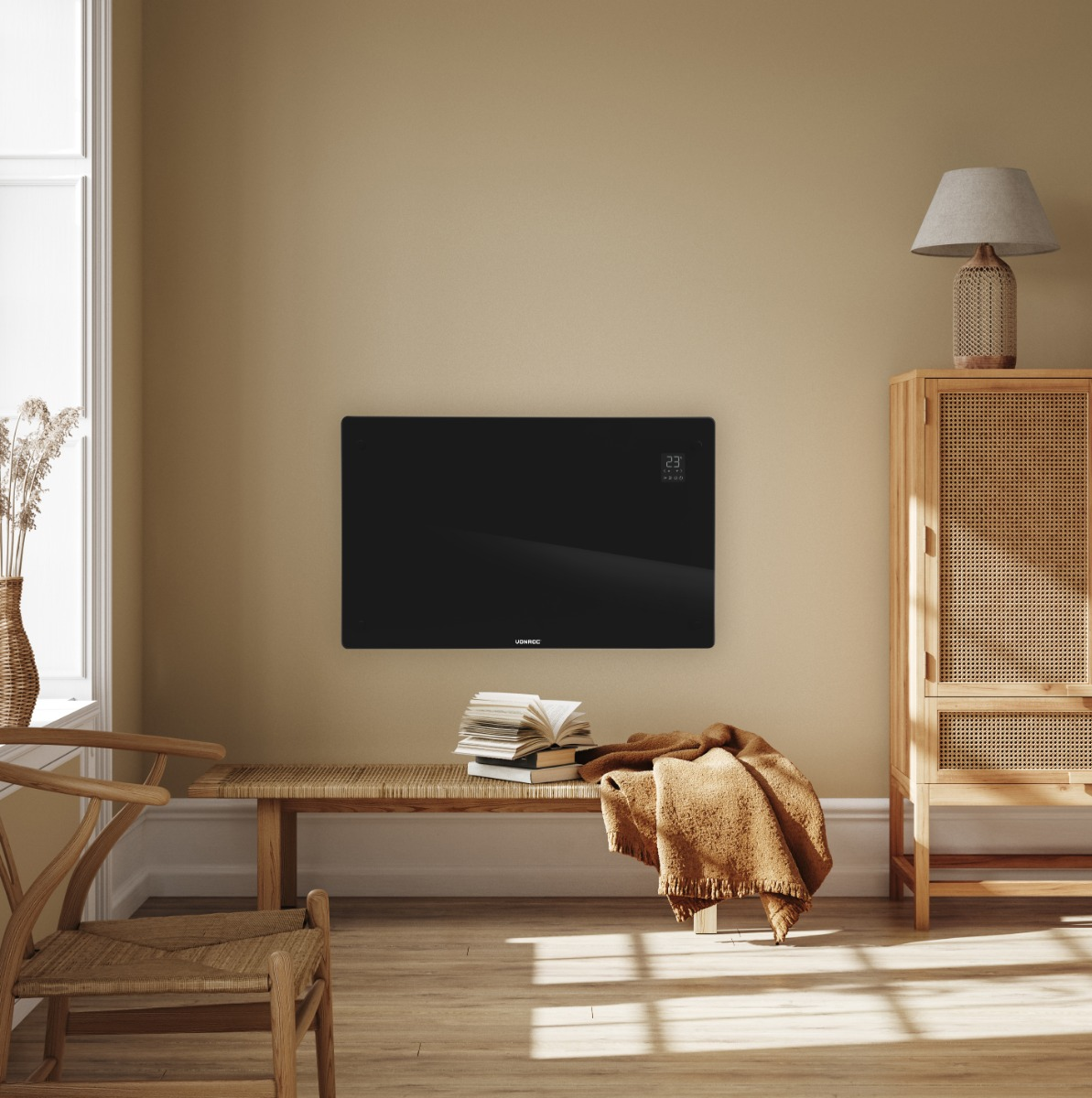 A black heater hangs on a wall above a wooden bench with books and a blanket.