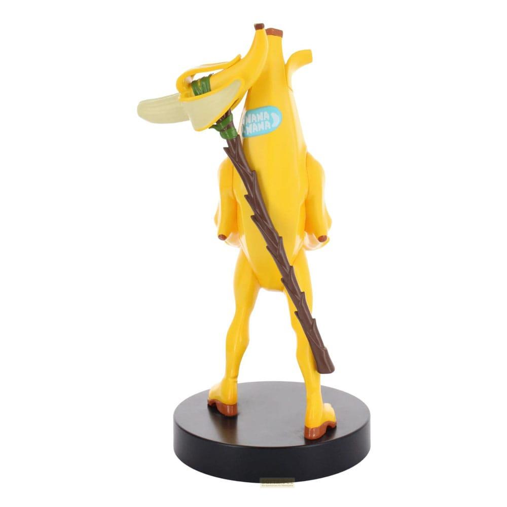 Una figurina di banana gialla con un bastone, su una base nera.