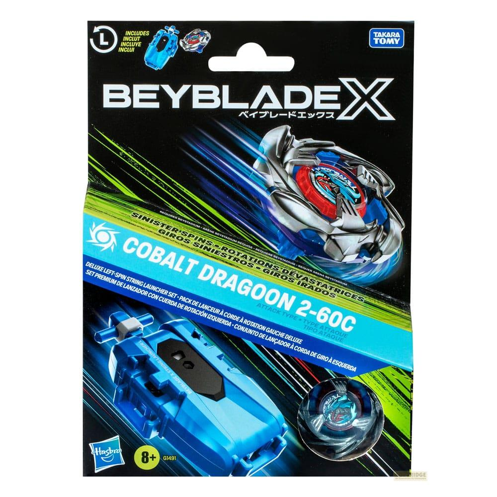 Confezione Beyblades con lanciatore blu, trottola e istruzioni.