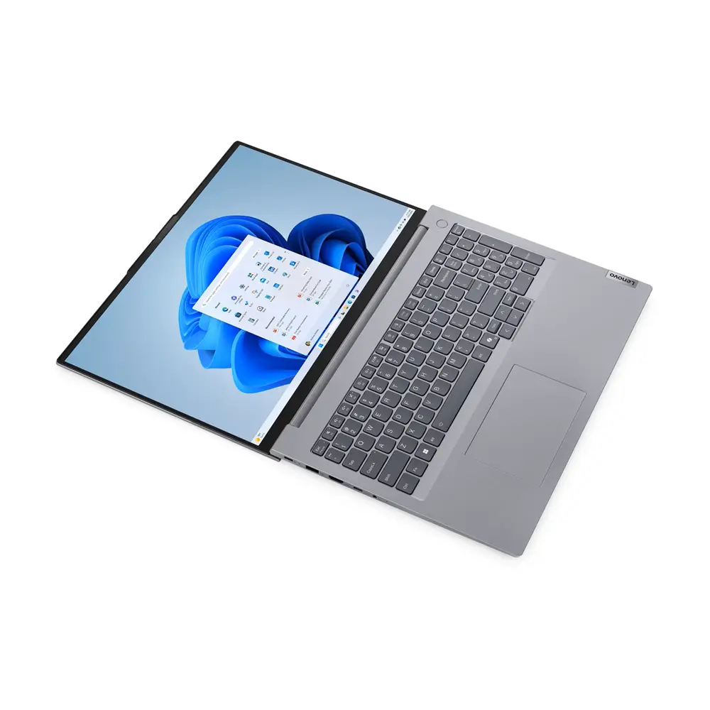 Windows 11 arka planını ve menülerini gösteren açık ekranlı gri dizüstü bilgisayar.