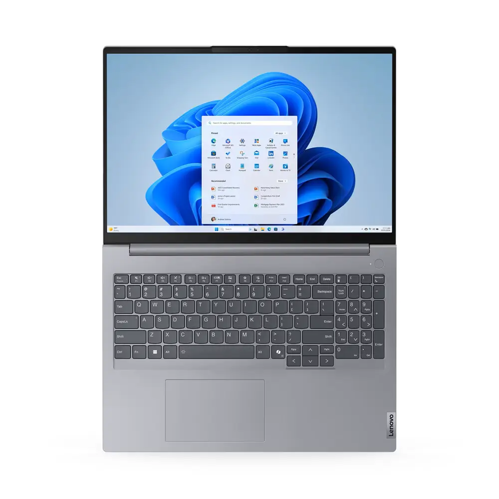 Ekranında Windows 11 duvar kağıdı gösteren açık gri Lenovo dizüstü bilgisayar.