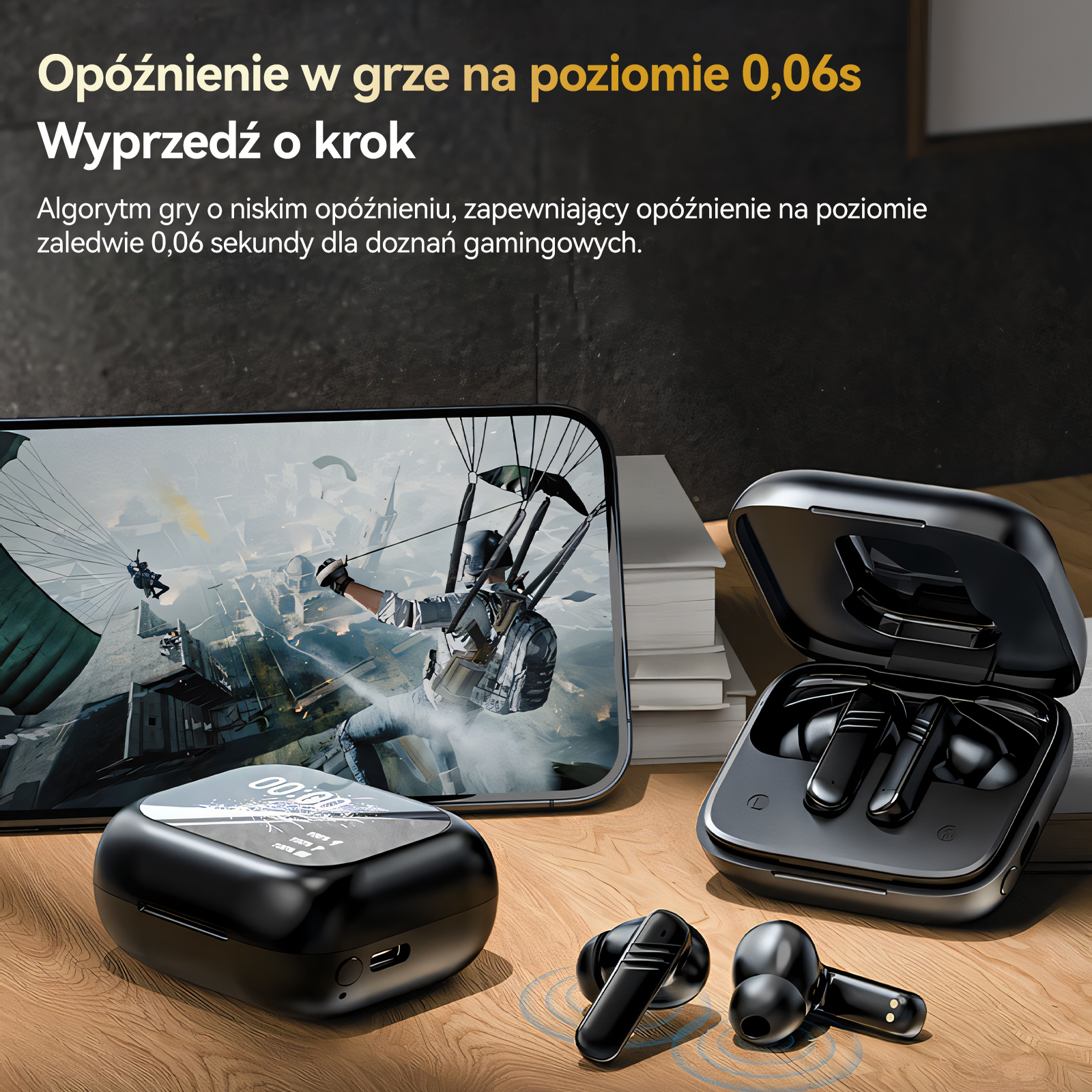 Czarne słuchawki obok telefonu wyświetlającego scenę gry.