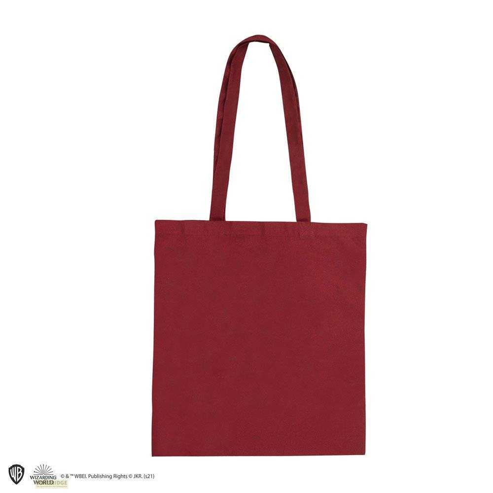 Eine dunkelrote Stofftasche mit zwei Henkeln, isoliert auf weißem Hintergrund.