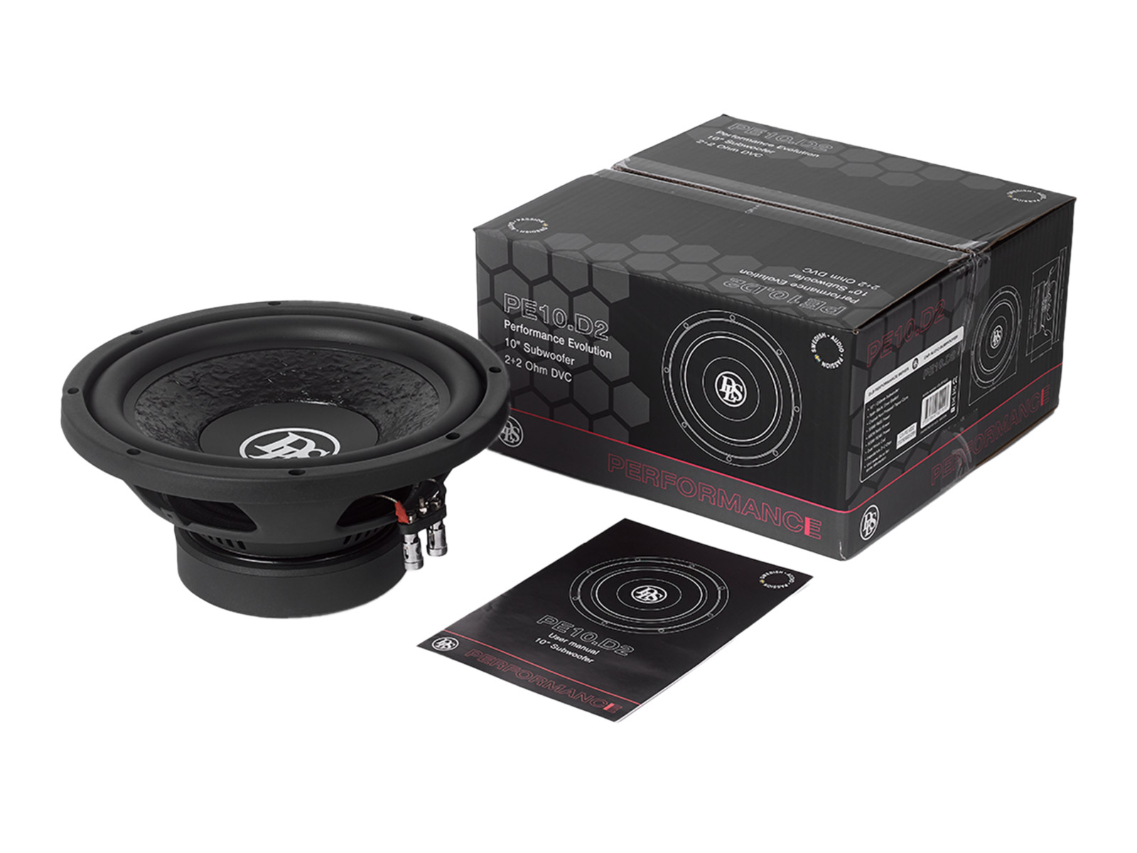 Ein schwarzer Subwoofer liegt neben seiner Verpackung und Anleitung.